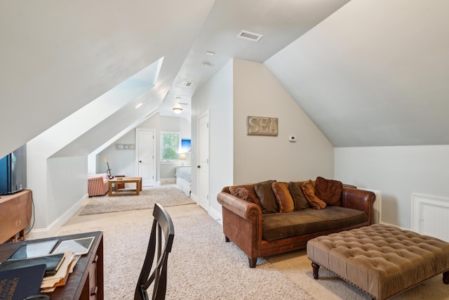 carpeted living room featuring lofted ceiling