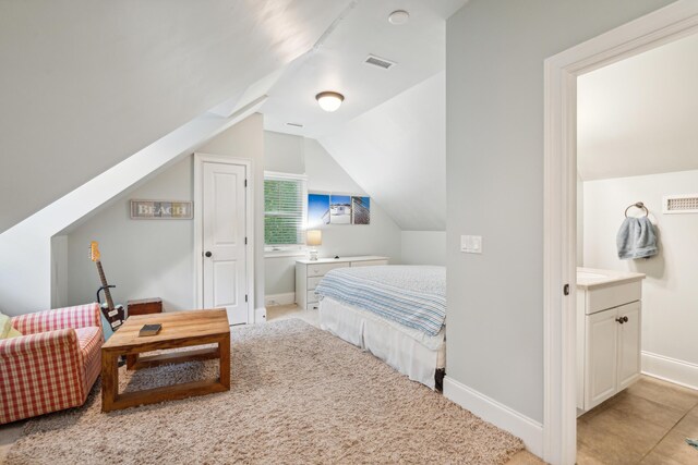 bedroom featuring lofted ceiling