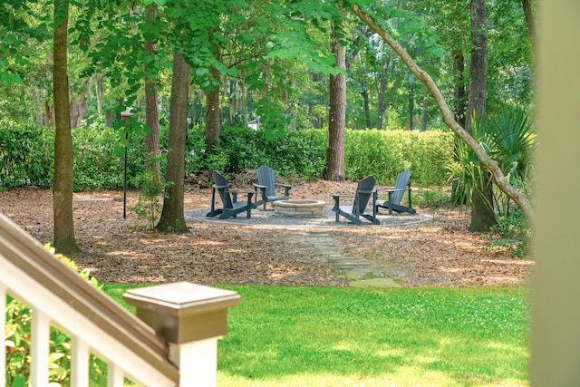 view of yard with an outdoor fire pit