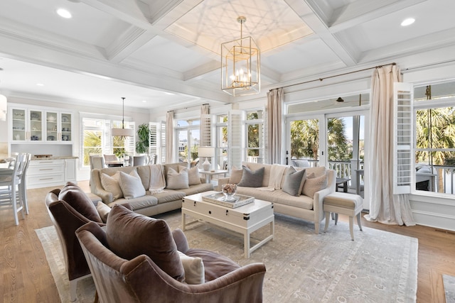 sunroom / solarium with coffered ceiling, a wealth of natural light, and french doors