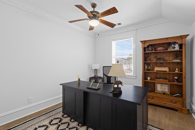 office space featuring ceiling fan, baseboards, crown molding, and wood finished floors