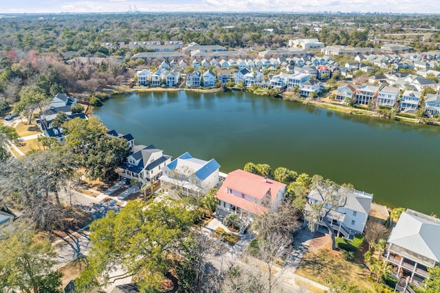 birds eye view of property with a residential view and a water view