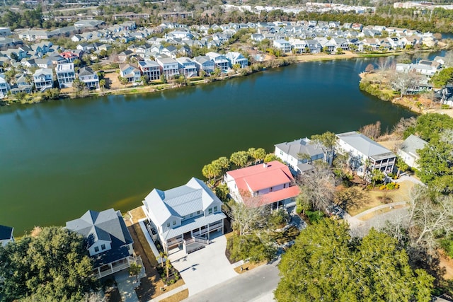 bird's eye view featuring a water view and a residential view