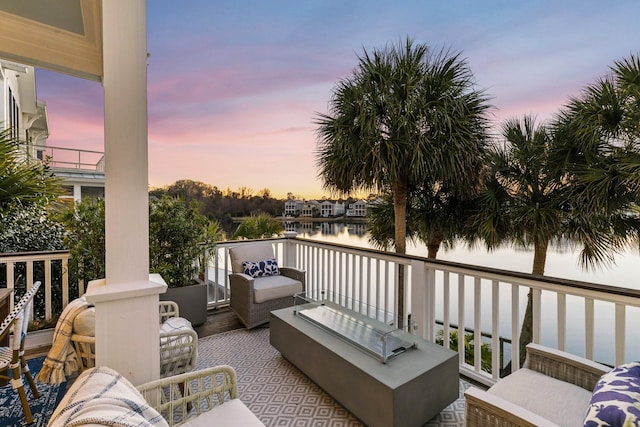 exterior space with a water view and outdoor lounge area