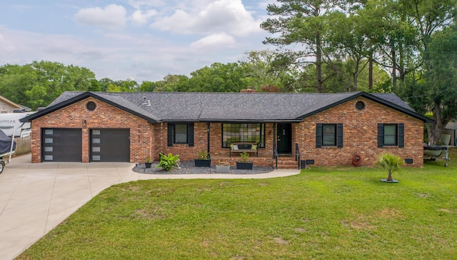 ranch-style house featuring a shingled roof, driveway, brick siding, an attached garage, and a front yard