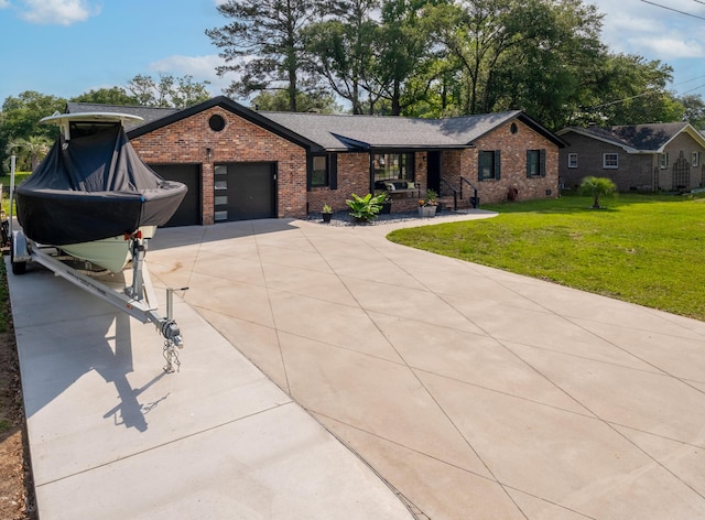 ranch-style house with brick siding, driveway, a front lawn, an attached garage, and covered porch