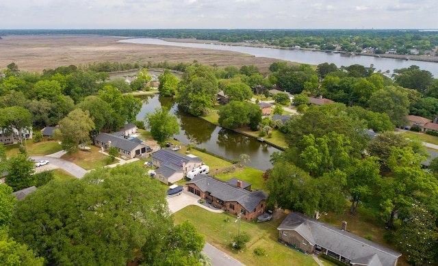 aerial view of residential area with a nearby body of water