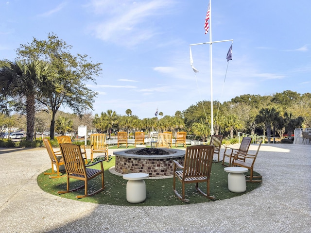 view of property's community with a fire pit