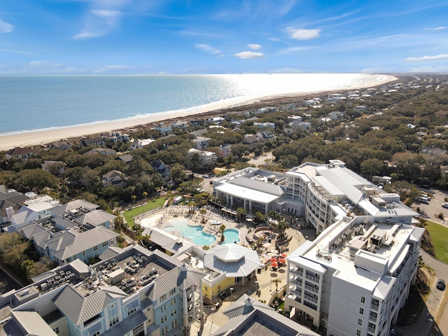 bird's eye view with a water view and a beach view