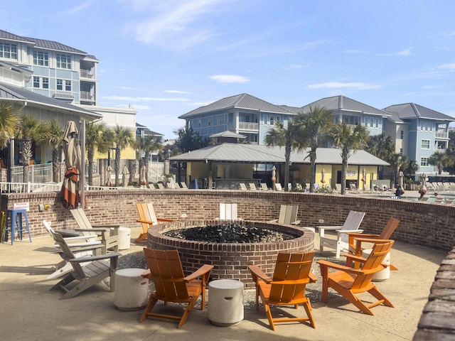 view of patio / terrace with a fire pit