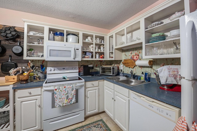 506 Arlington Dr Unit F, Charleston, SC 29414 - kitchen featuring white appliances, open shelves, a sink, a textured ceiling, and dark countertops