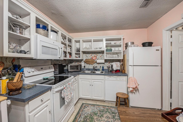 506 Arlington Dr Unit F, Charleston, SC 29414 - kitchen with white appliances, open shelves, a sink, dark countertops, and a textured ceiling