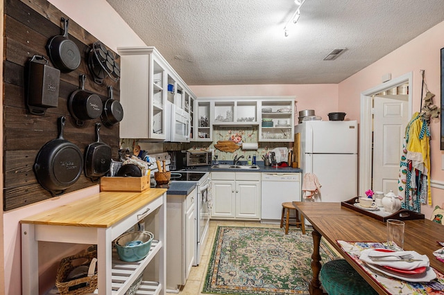 506 Arlington Dr Unit F, Charleston, SC 29414 - kitchen with white appliances, open shelves, a sink, a textured ceiling, and glass insert cabinets