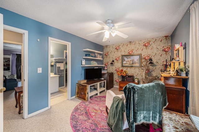 506 Arlington Dr Unit F, Charleston, SC 29414 - carpeted living room featuring ceiling fan, baseboards, an accent wall, and wallpapered walls