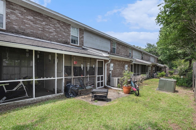 506 Arlington Dr Unit F, Charleston, SC 29414 - rear view of property with a sunroom, brick siding, a yard, central air condition unit, and a patio area