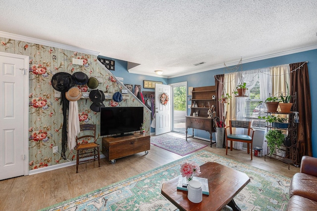 506 Arlington Dr Unit F, Charleston, SC 29414 - living room with wood finished floors, a textured ceiling, crown molding, wallpapered walls, and baseboards