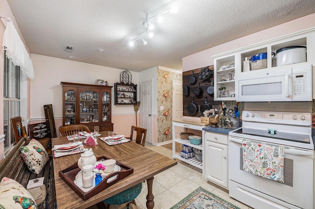 506 Arlington Dr Unit F, Charleston, SC 29414 - kitchen with white appliances, open shelves, a textured ceiling, light tile patterned floors, and white cabinets