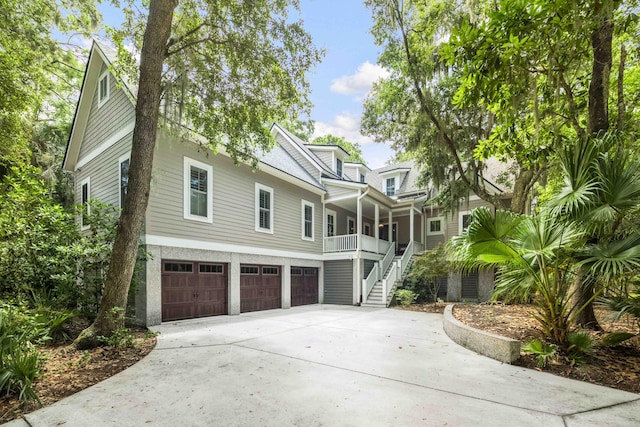 view of front of house with a garage and a porch