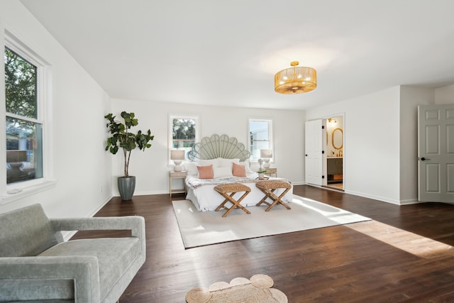 bedroom with dark hardwood / wood-style floors