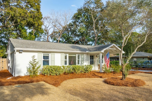 ranch-style home with a carport