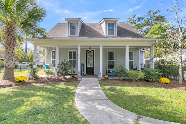 bungalow-style home featuring a porch and a front yard