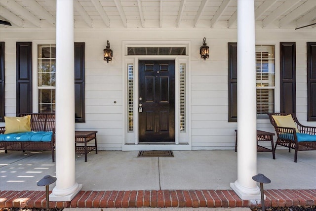 property entrance with covered porch