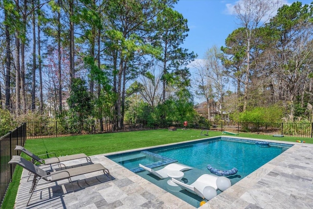 view of pool with a patio, a yard, a fenced backyard, and a pool with connected hot tub