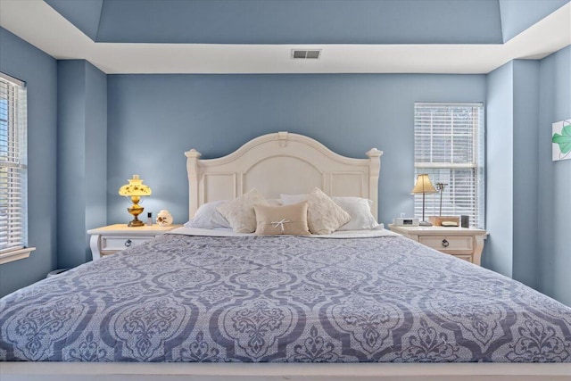 bedroom featuring visible vents