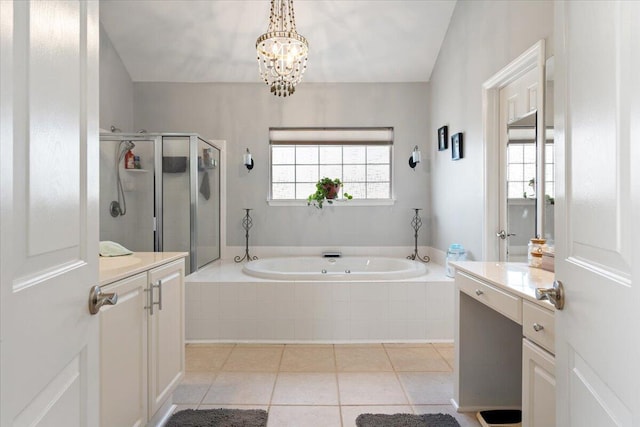 full bath featuring a stall shower, an inviting chandelier, tile patterned flooring, a bath, and vanity