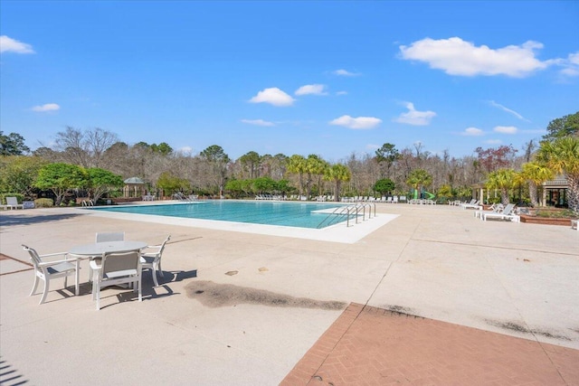 community pool featuring a patio