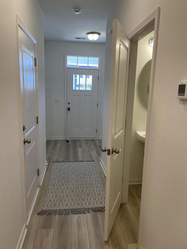 doorway featuring light hardwood / wood-style floors