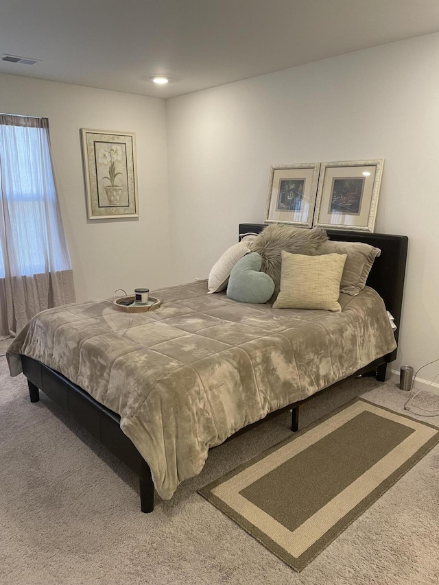 bedroom featuring carpet