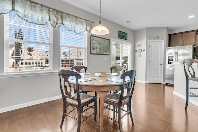 dining space featuring hardwood / wood-style floors