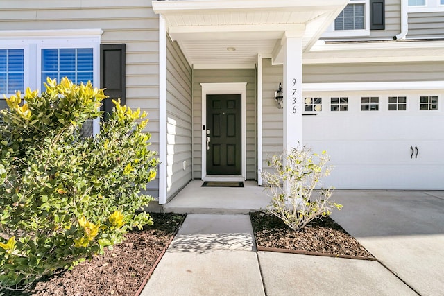 doorway to property featuring a garage