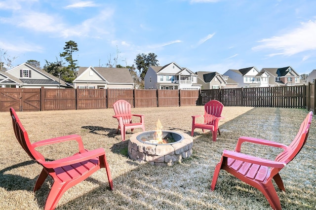 view of yard featuring an outdoor fire pit