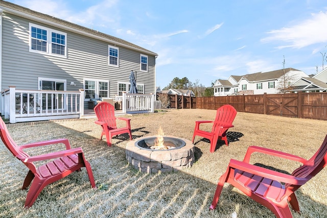 view of patio featuring a deck and an outdoor fire pit