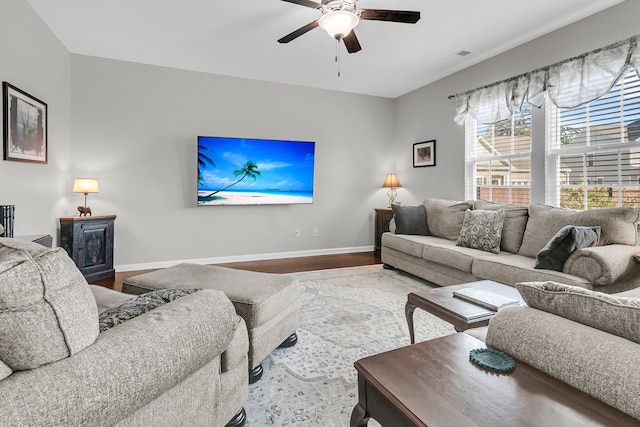 living room with hardwood / wood-style flooring and ceiling fan