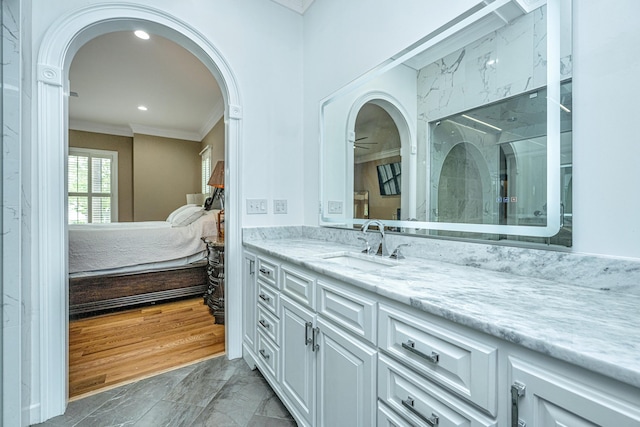 full bathroom with crown molding, recessed lighting, connected bathroom, vanity, and walk in shower