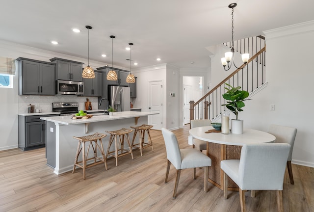 dining area with baseboards, ornamental molding, stairs, light wood-type flooring, and recessed lighting