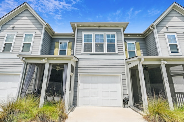 townhome / multi-family property featuring a garage