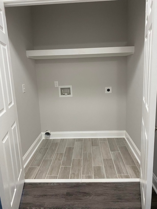 clothes washing area with electric dryer hookup, hookup for a washing machine, and hardwood / wood-style flooring