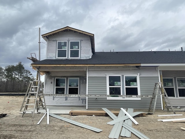 view of front of home with roof with shingles