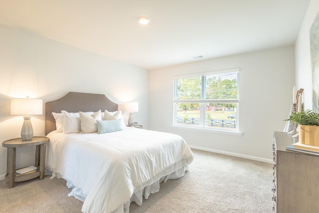 bedroom featuring light colored carpet