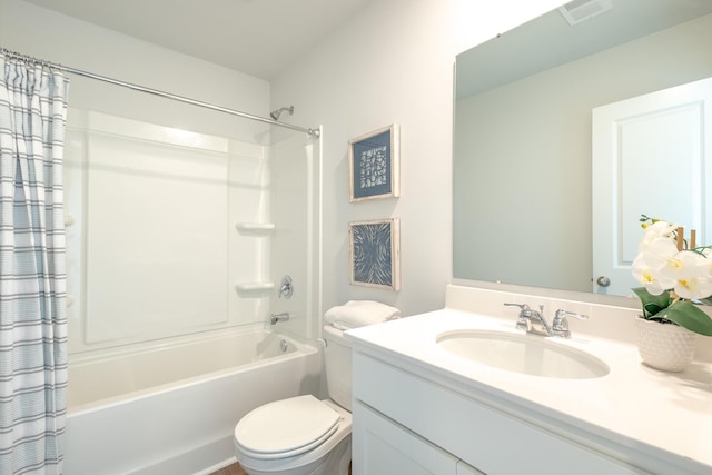 full bathroom featuring vanity, shower / bath combination with curtain, and toilet