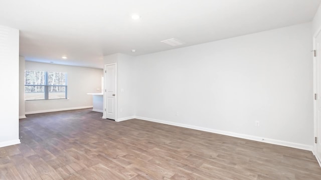 unfurnished room featuring hardwood / wood-style flooring