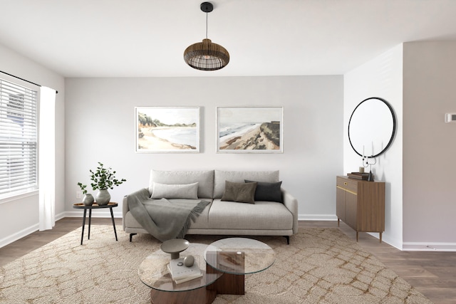 living room with a healthy amount of sunlight and dark wood-type flooring