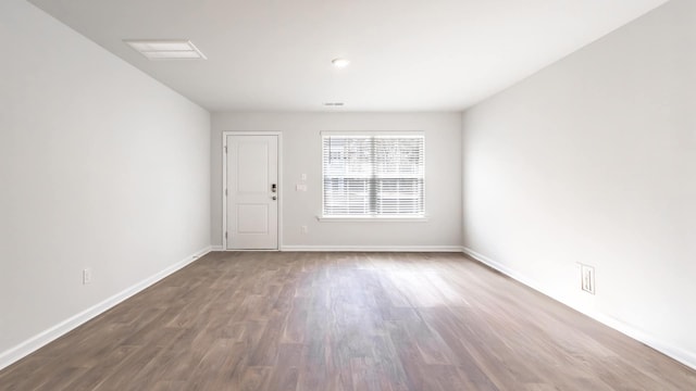 empty room featuring wood-type flooring