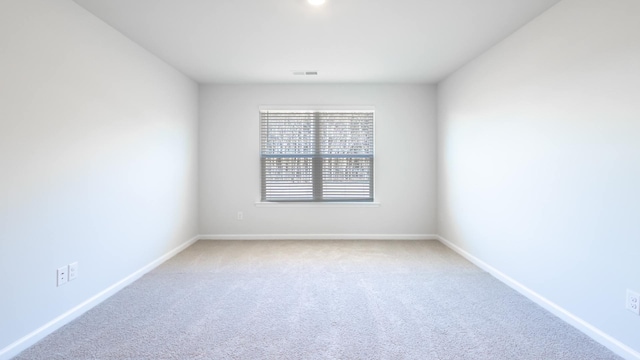 empty room with carpet flooring