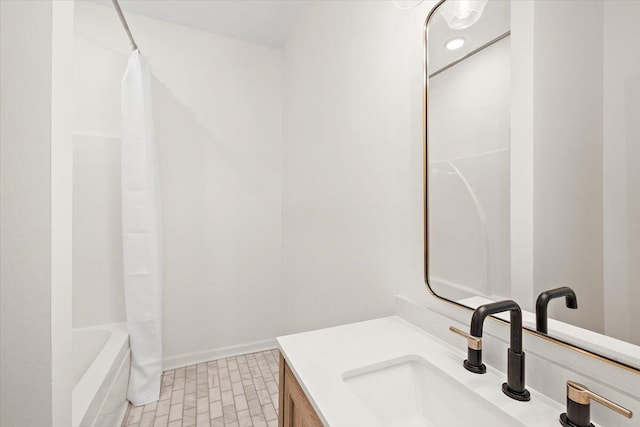 bathroom with vanity and shower / bath combo with shower curtain