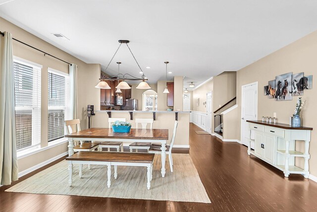 dining space featuring hardwood / wood-style flooring